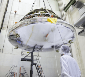 space craft being craned in high bay cleanroom, NASA Cape Canaveral cleanroom